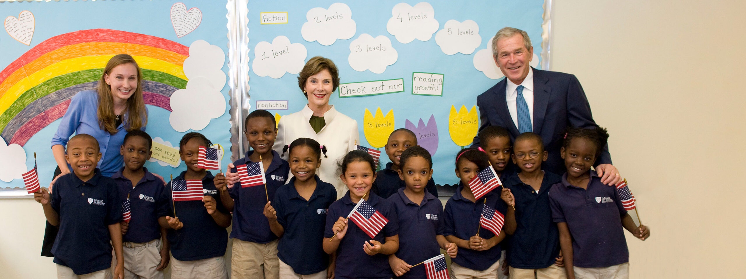 The President and Mrs. Laura Bush in a classroom with elementary students and their teacher.